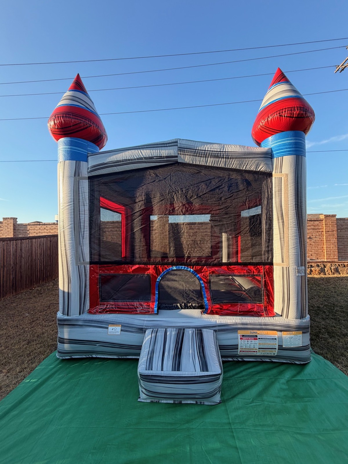 Titanium Castle dry bounce house in a backyard